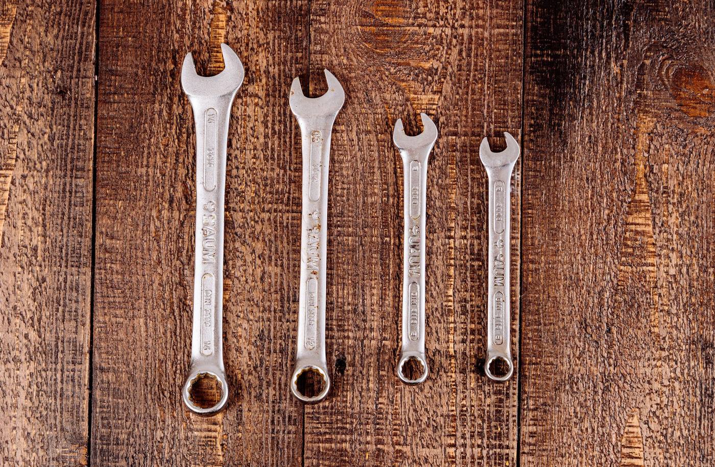Wrenches on a wooden bench
